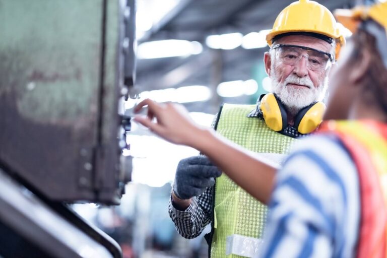Factory workers finding a solution to a problem