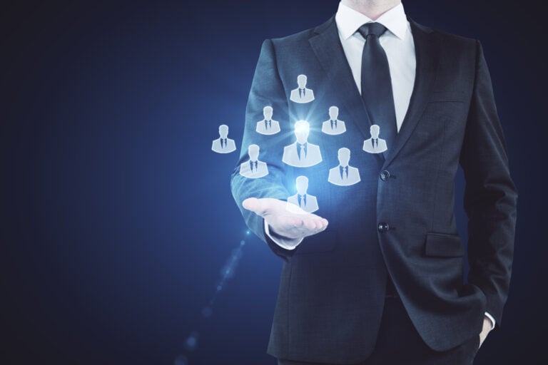 Businessman Holding Hr Hologram On Dark Background.