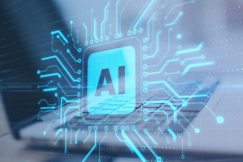 Glowing AI interface over a laptop keyboard with digital circuitry, representing artificial intelligence systems, data processing, and regulatory compliance technology