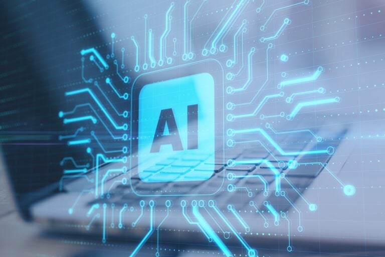Glowing AI interface over a laptop keyboard with digital circuitry, representing artificial intelligence systems, data processing, and regulatory compliance technology